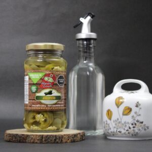 Frasco de ají de jalapeño artesanal Alicolombia, conserva 100% natural, intensidad ideal para tus comidas.